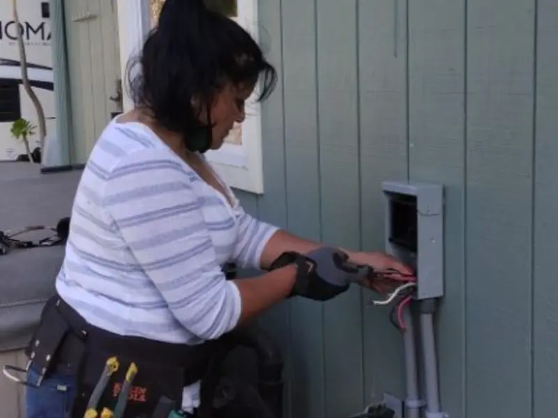 Licensed electrician wiring an exterior subpanel in Yuba City